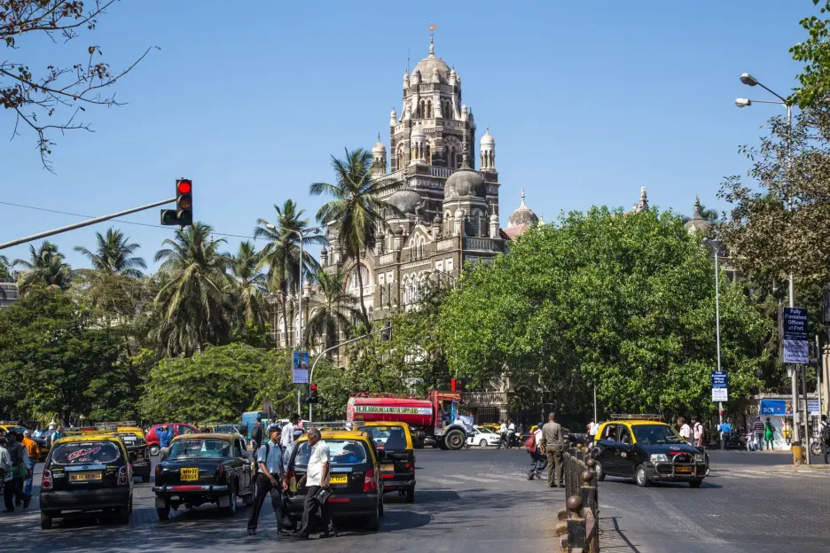 The Western Railway Headquarters building with Mumbai traffic in the foreground.