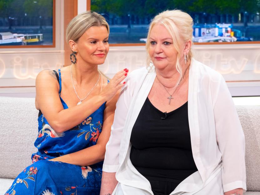 Kerry Katona with her hand on her mother Sue Katona's shoulder during a TV interview.