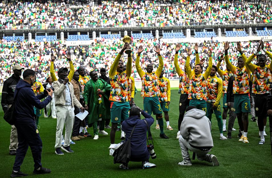 Senegal players parade with the African Cup of Nations trophy.