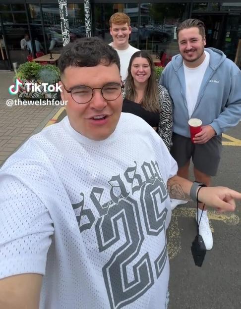 Four people associated with "The Welsh 5" TikTok account posing outdoors.