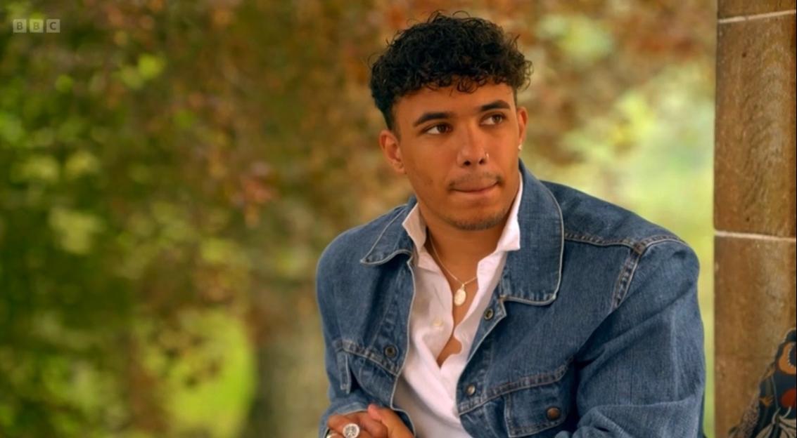 Freddie Fraser in a denim jacket and white shirt.
