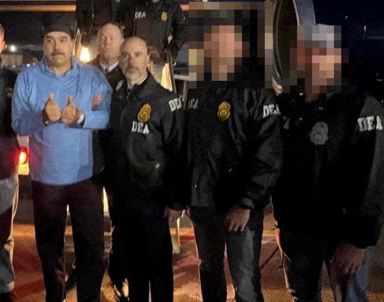 : Venezuela's captured President Nicolas Maduro poses next to DEA administrator Terry Cole in Newburgh