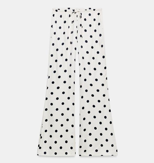 White trousers with black polka dots.