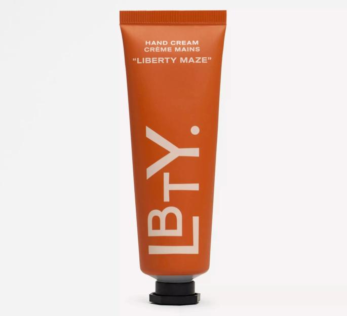 An orange tube of L.B.T.Y. "Liberty Maze" hand cream.