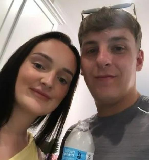 Millie Radford and her fiancé posing for a selfie before fireworks.