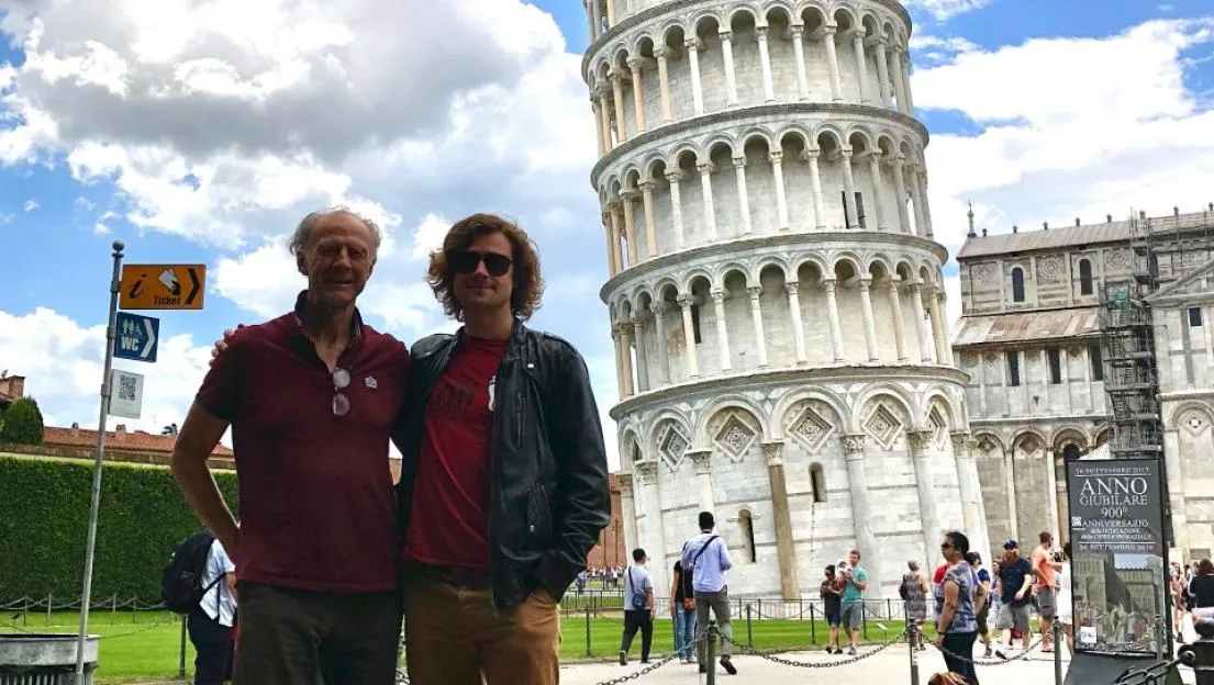 Ranulph Fiennes and step-son Alex Millington standing in front of the Leaning Tower of Pisa.