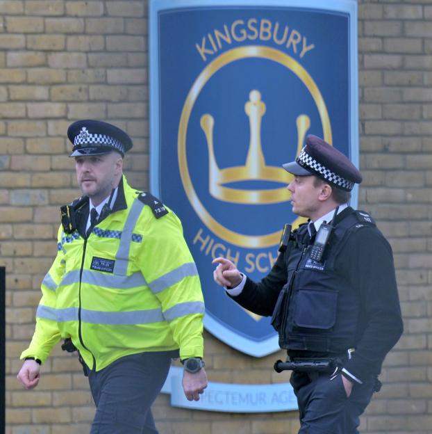 Police officers outside Kingsbury High School.
