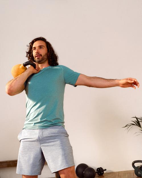 Joe Wicks, Lululemon's Global Ambassador, exercising with a kettlebell.