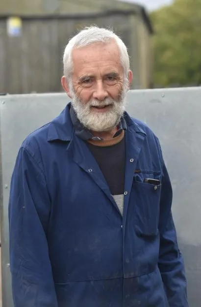 Farmer Chris Kirby standing outside.
