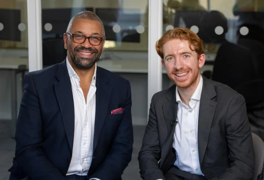 James Cleverly and Tom Newton Dunn smiling.