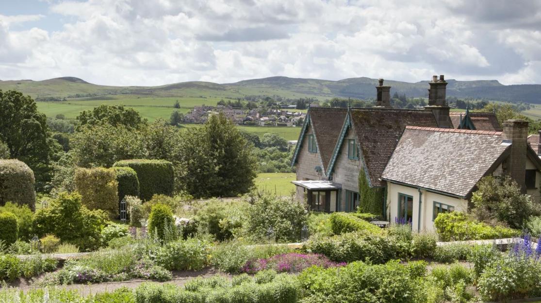 Cragside Garden Cottage, a house built by Victorian inventor Lord Armstrong, with surrounding formal gardens, overlooking Coquet Valley and Simonside Hills.