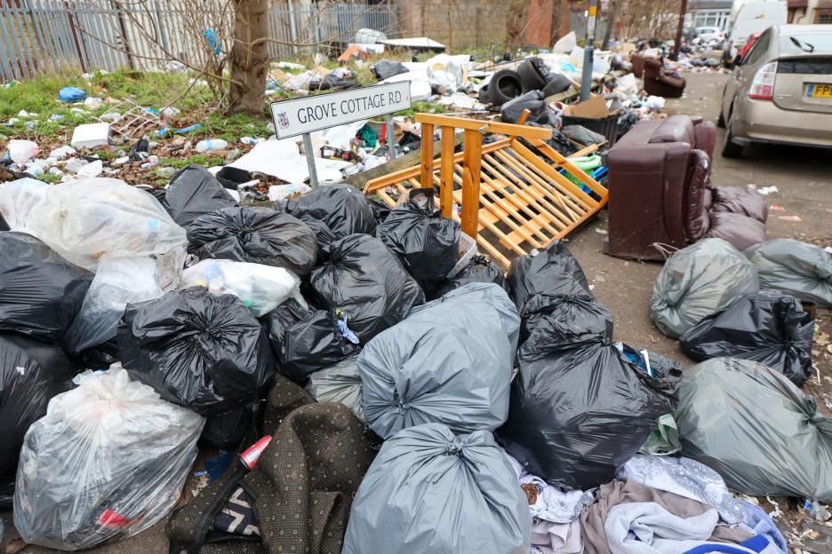 Pile of bin bags and rubbish on Grove Cottage Road due to a bin strike.