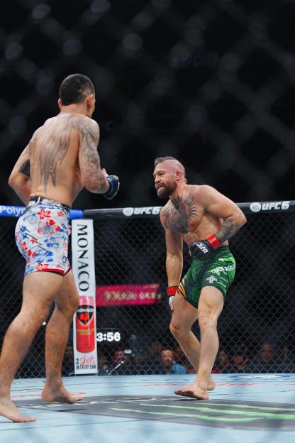 Conor McGregor and Max Holloway face off in the octagon during UFC 329.