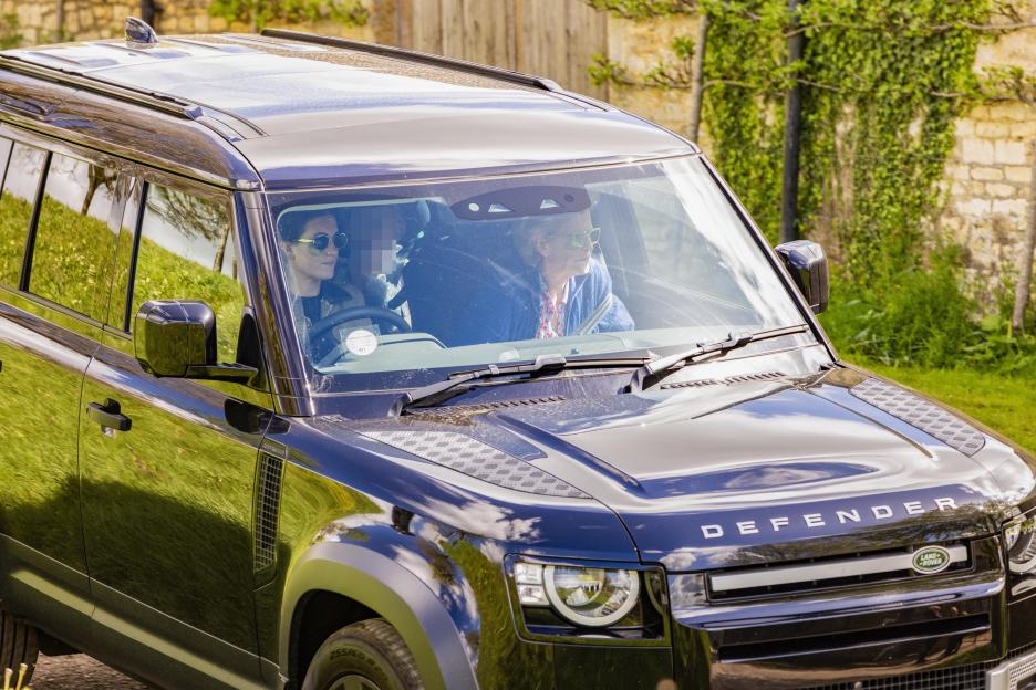 Wedding guests arriving in a black Land Rover Defender at Euridge Manor.