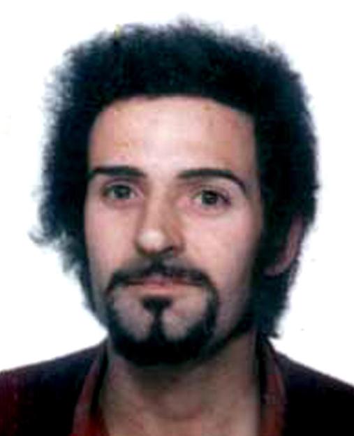 Headshot of Peter Sutcliffe, the Yorkshire Ripper, with dark curly hair and a mustache and goatee.