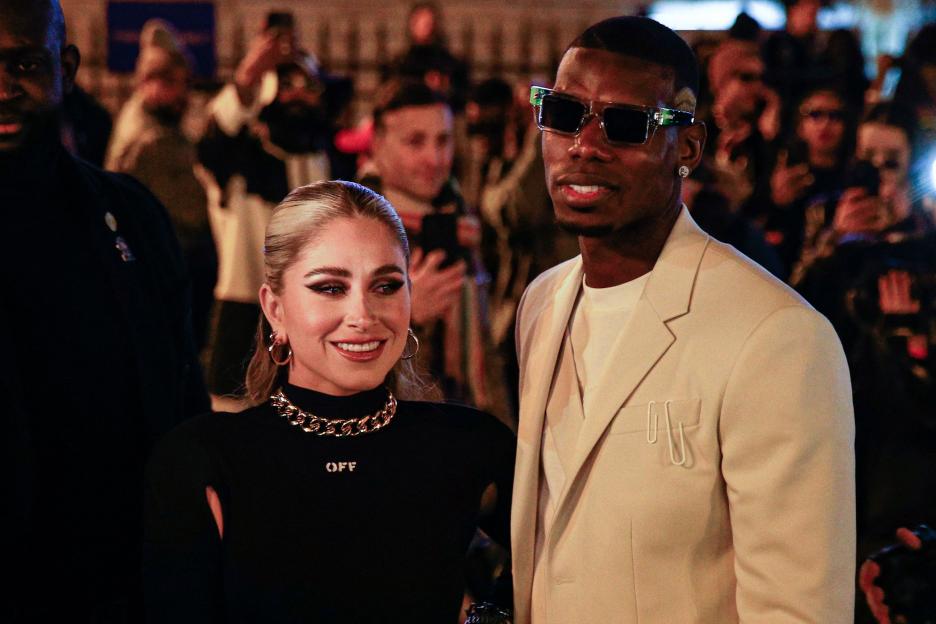 Football player Paul Pogba and his wife Maria Zulay Salaues leaving a fashion show.