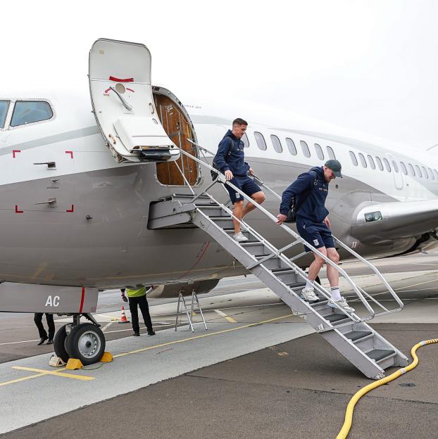 Lech Poznan players disembarking from a plane.
