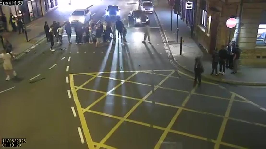 Nighttime surveillance footage of a traffic collision on Epsom High Street.