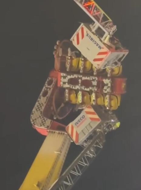 VIDEO: Thrill seekers spend FOUR HOURS dangling 100ft in air after ride malfunctions