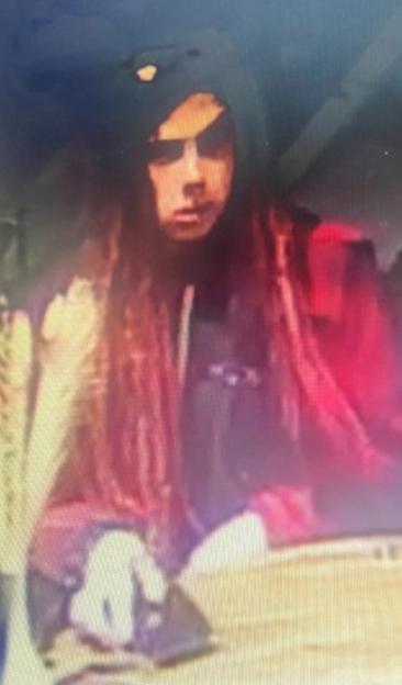 Suspect in black hoodie with an eyepatch.