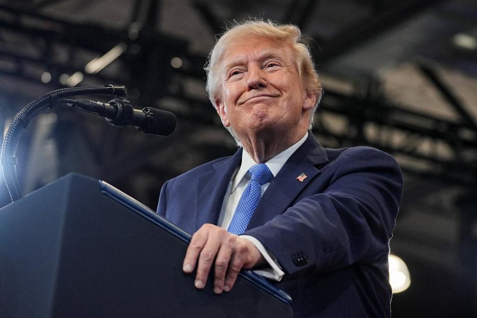 U.S. President Donald Trump delivering remarks from behind a podium.
