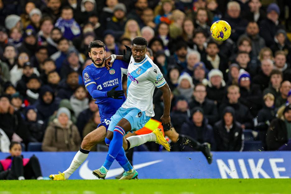 Armando Broja of Chelsea and Marc Guehi of Crystal Palace tussle for the ball.
