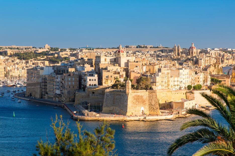 View of Senglea, Malta from Valletta with buildings and fortifications along the waterfront.