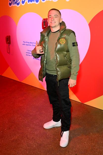 ArrDee posing and giving a thumbs up at the "Chicken Shop Date: 10 Years Of An Idea" event.