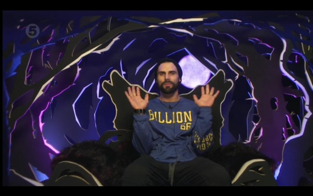 Jeremy Jackson seated with his hands raised during his eviction from the Celebrity Big Brother house.