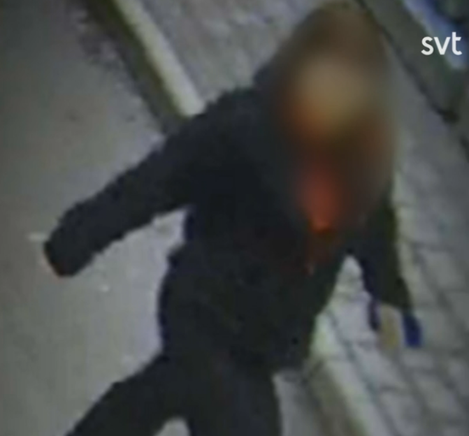 CCTV footage showing a person with their face blurred out.