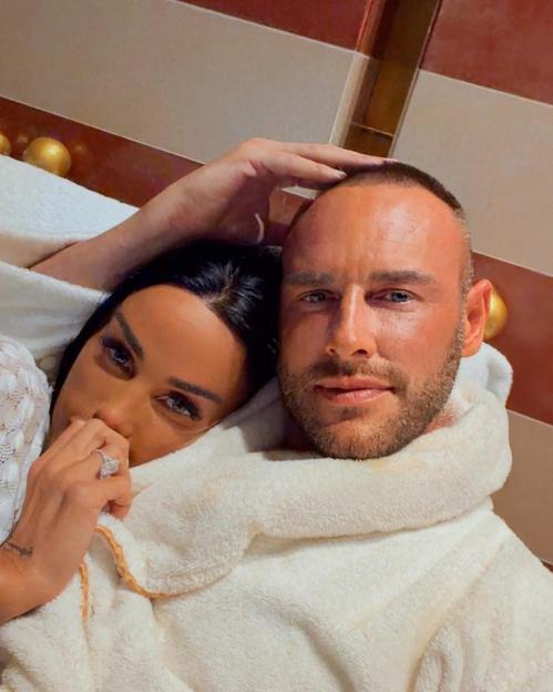 Katie Price and Lee Andrews wrapped in white towels.