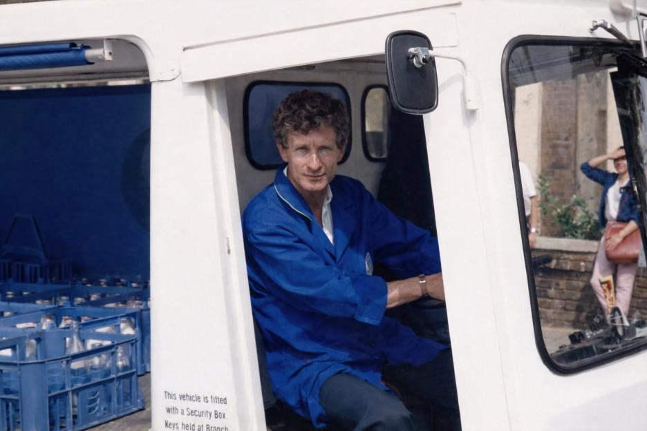 Actor Nick Joseph sitting in a white vehicle.