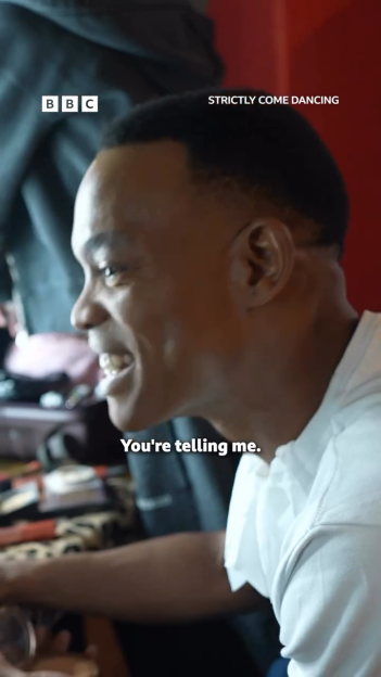 Johannes Radebe laughing and speaking with the caption "You're telling me."