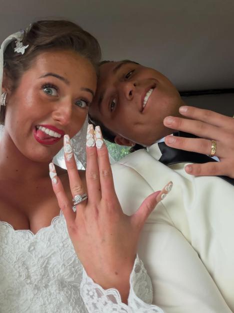 Venezuela Fury and Noah Price showing off their rings in a wedding selfie.