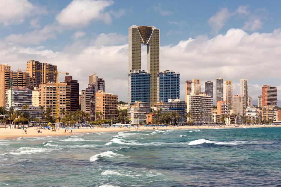 The Benidorm skyline in Spain, with hotels and apartment buildings along the coast.