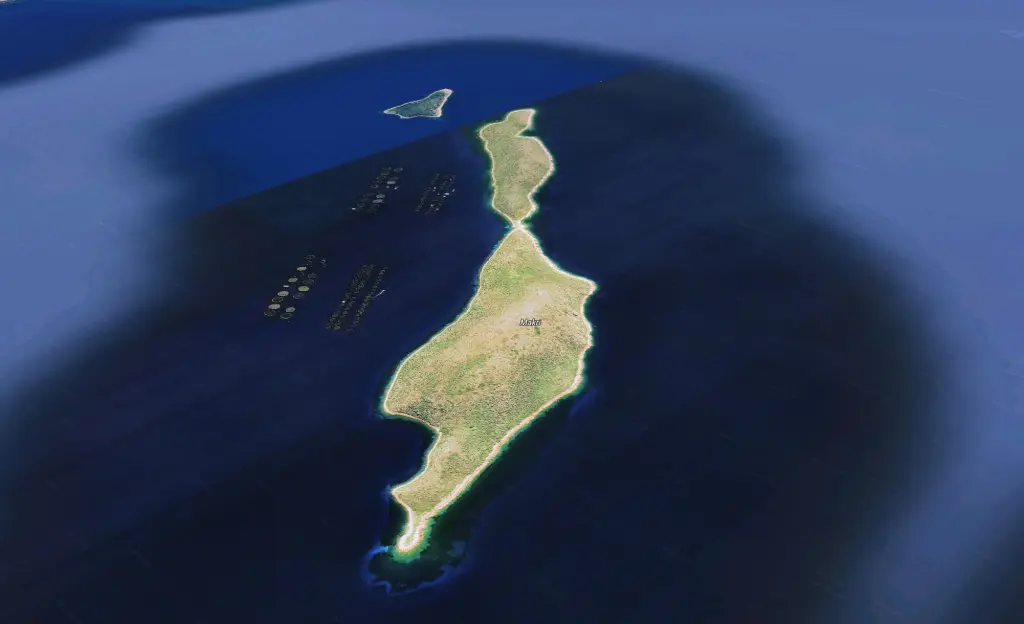 Aerial view of Makri Island, Greece, showing the island in dark blue water.