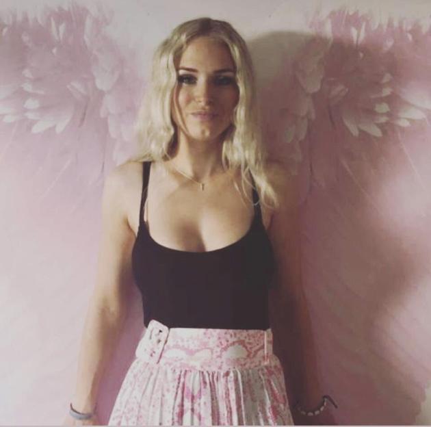 Zoe Hughes, pictured with painted angel wings behind her, campaigned for stricter alcohol delivery rules.