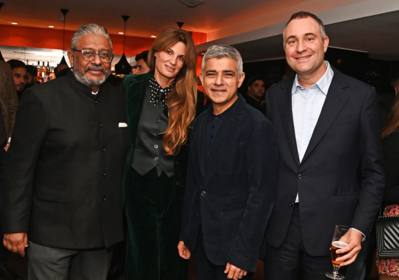 Four people posing for a photo.