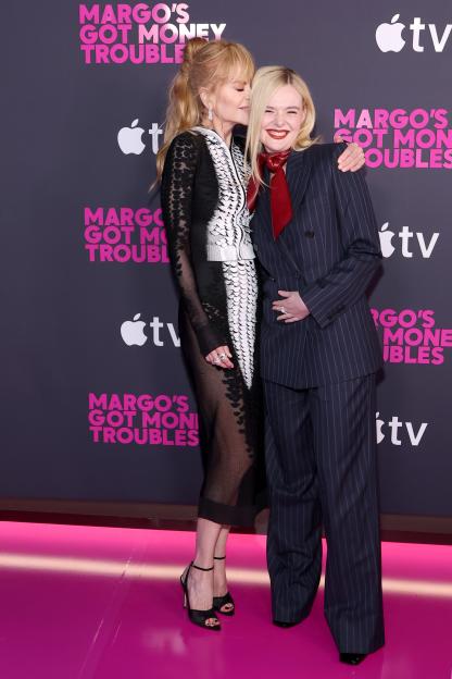 Nicole Kidman and Elle Fanning embrace at Apple's "Margo's Got Money Troubles" premiere.