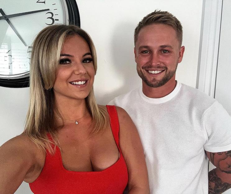 Alfie Browne-Sykes and a woman smiling at the camera.