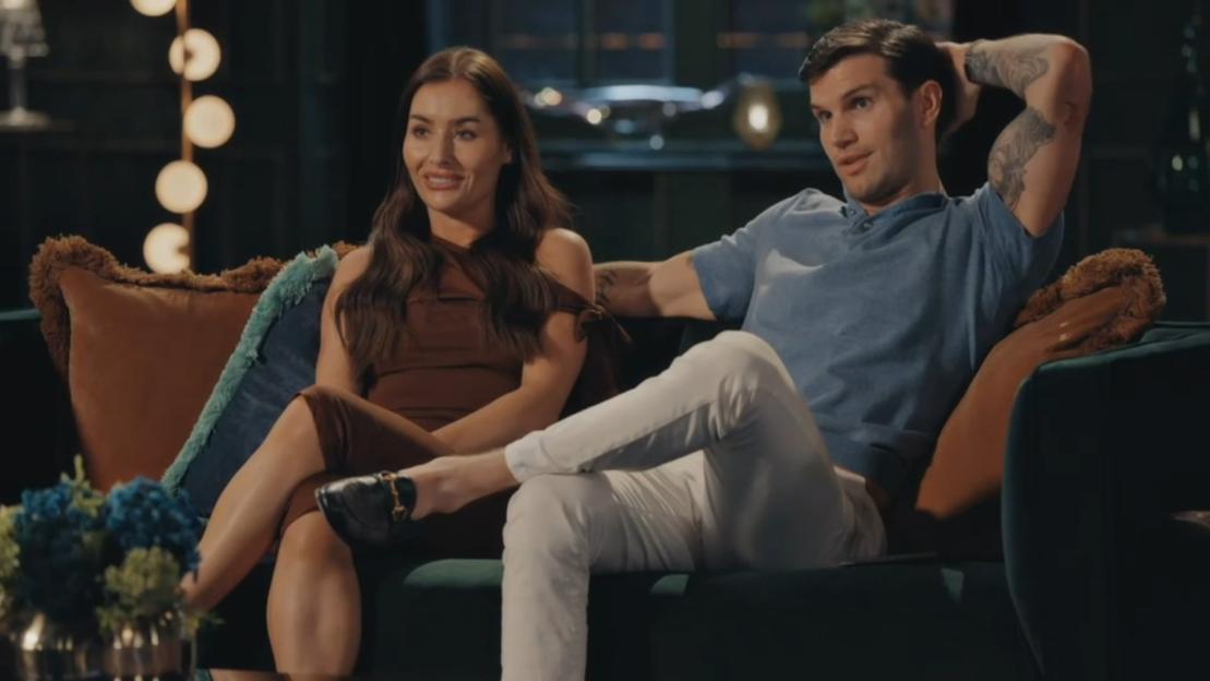 Leisha and Reiss sitting together on a couch.