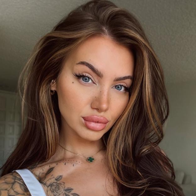 Faye Winter from Love Island with long brown hair.