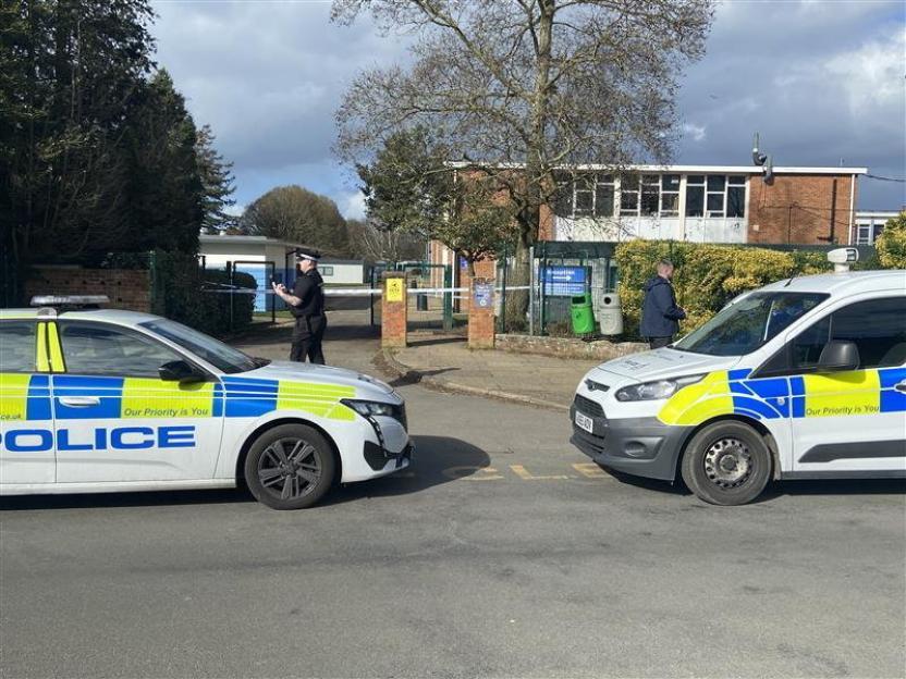 Police cars and personnel outside Thorpe St Andrew School following a stabbing incident.