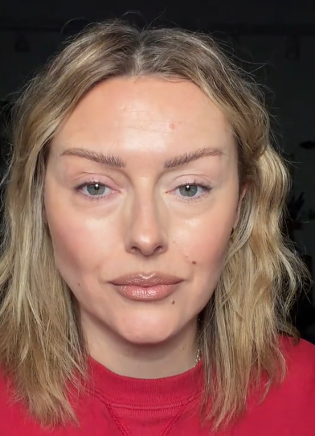 Woman with fair skin and blonde hair demonstrating an incorrect concealer application under her eyes.