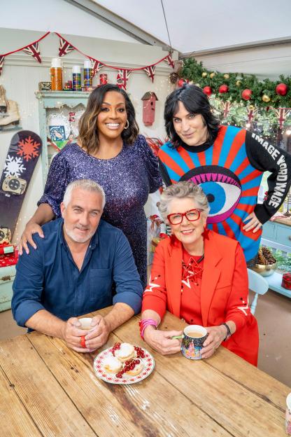 Hosts and judges of The Great Christmas Bake Off 2024 posing for a photo.