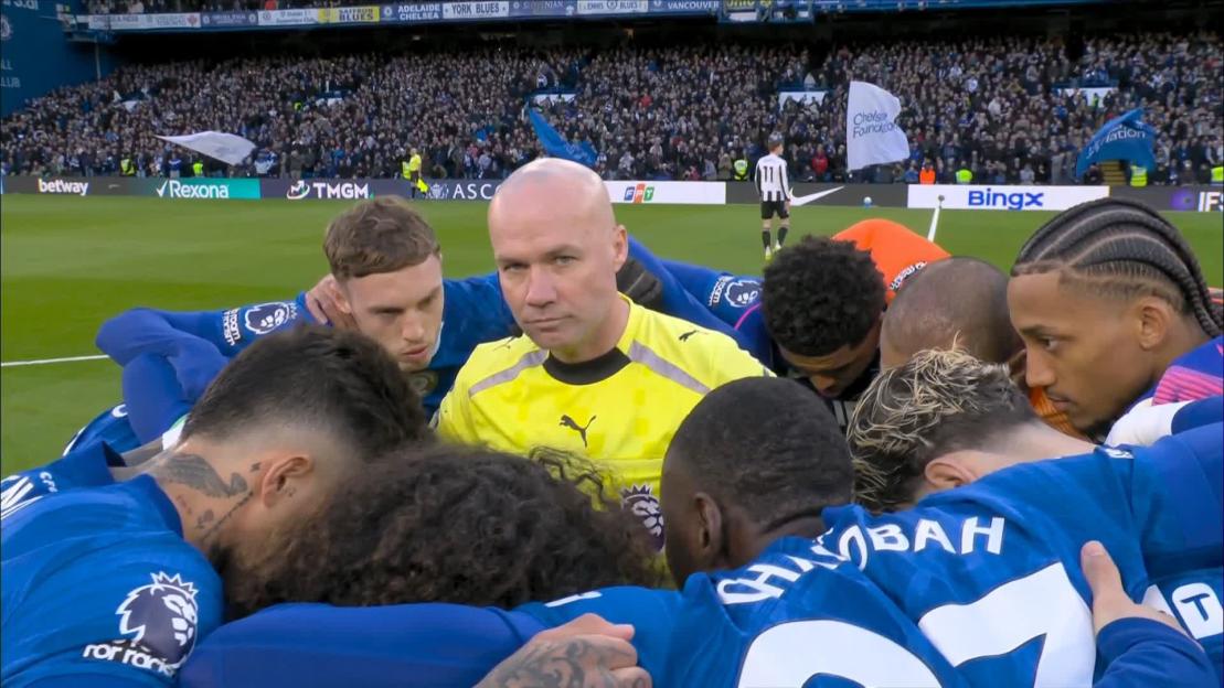 Referee Paul Tierney Finds Himself in the Thick of Chelsea's Huddle Before Newcastle Showdown