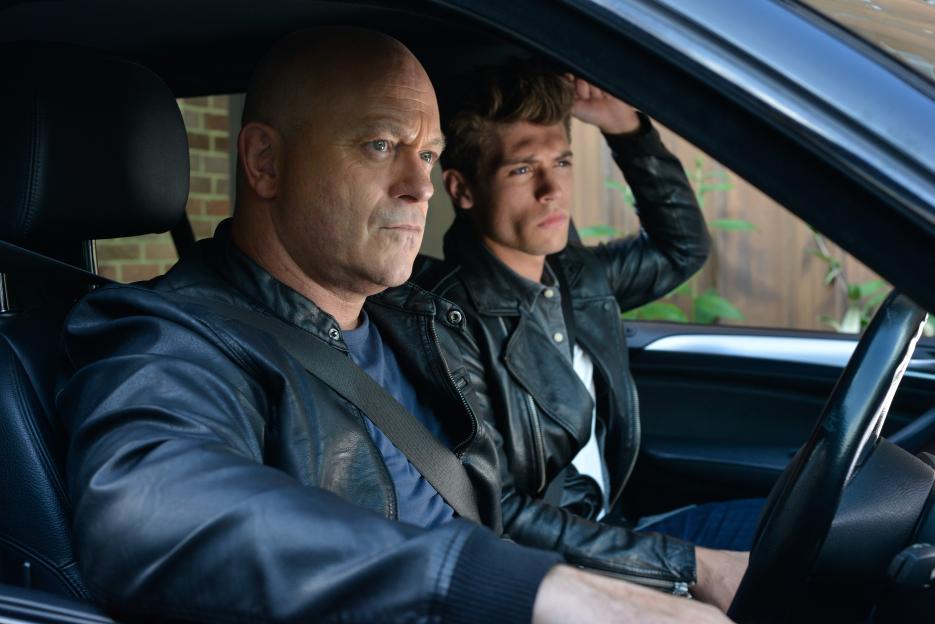 Grant Mitchell (Ross Kemp) and Mark Fowler Jr (Ned Porteous) in a car.
