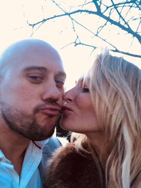 A man and a woman about to kiss.