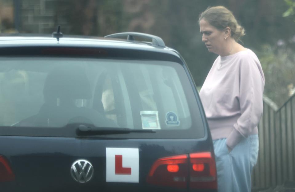 Caroline Lyons speaking to her husband, Reverend Edward Lyons, outside of the church manse.