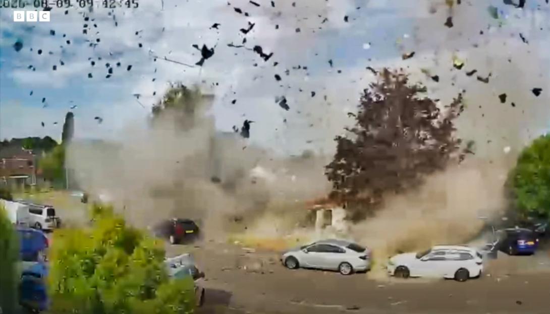 CCTV footage captures the moment a bungalow explodes, sending debris flying.